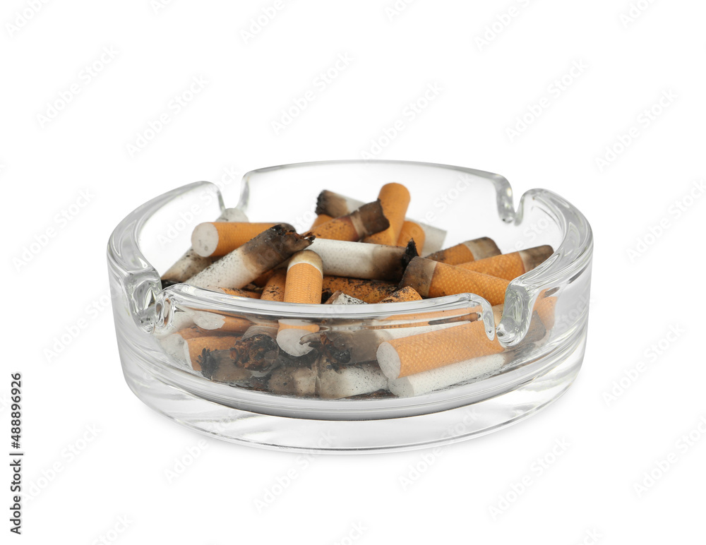 Glass ashtray with cigarette stubs isolated on white Glass ashtray with cigarette stubs isolated on white