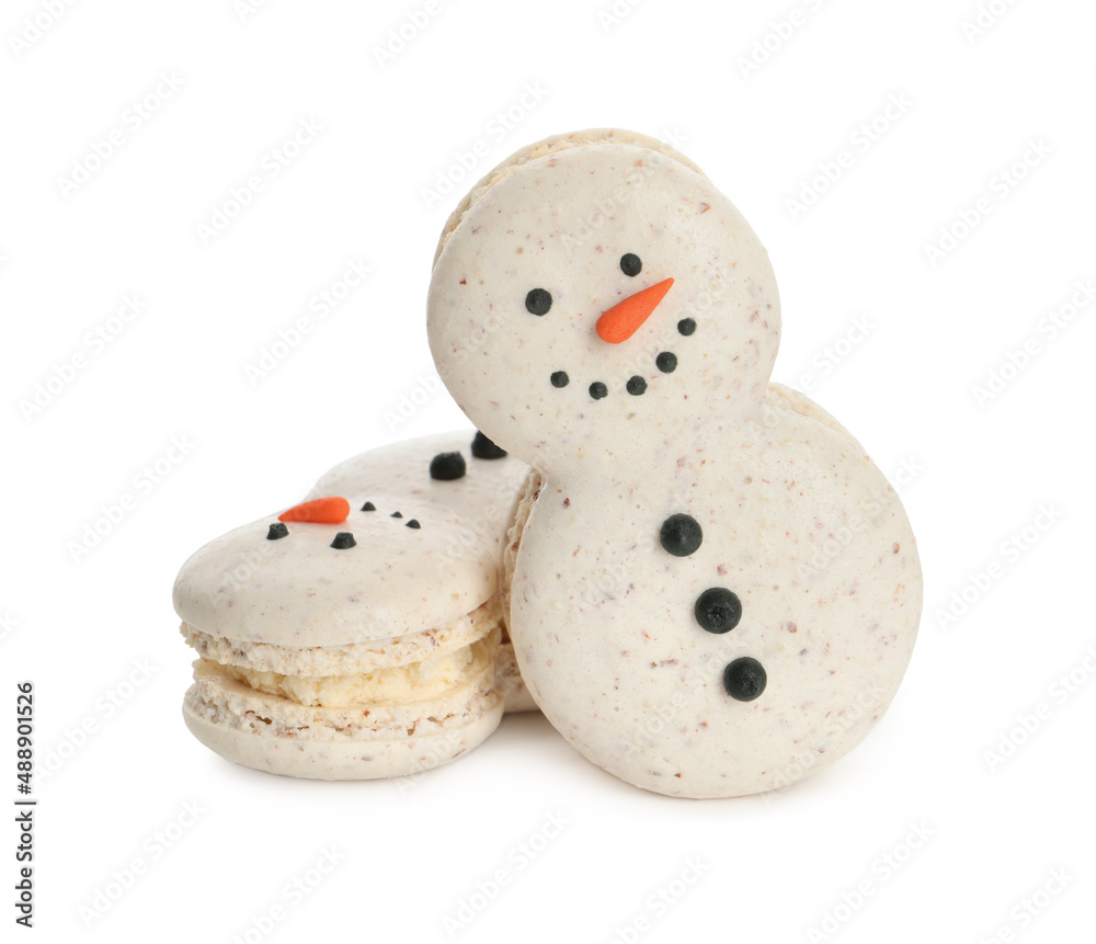 Beautifully decorated Christmas macarons on white background