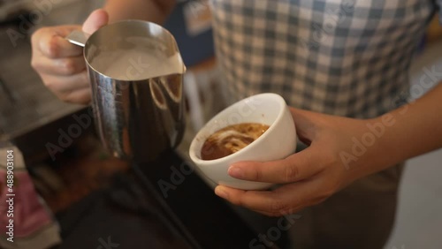 Coffee worker using espresso machine Make coffee for customers in the shop