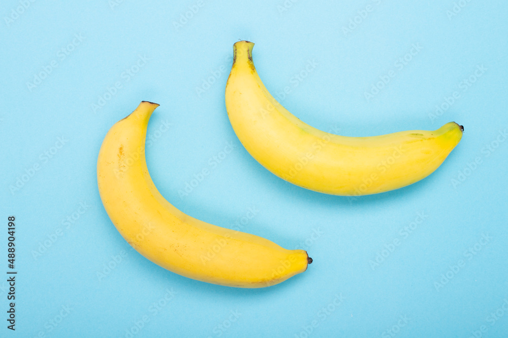 Two Banana isolated on blue background