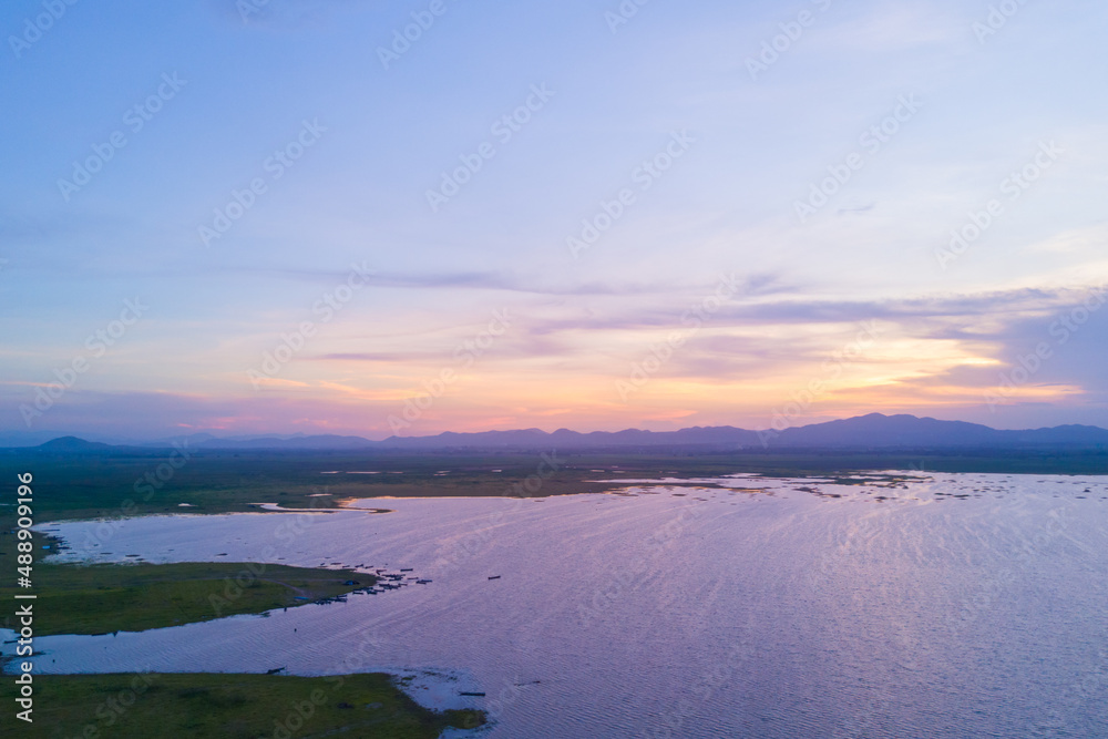 Beautiful landscape aerial view of sunset over lake as a mountain background, Nature Background