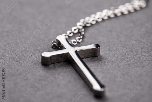 Silver cross on a gray background
