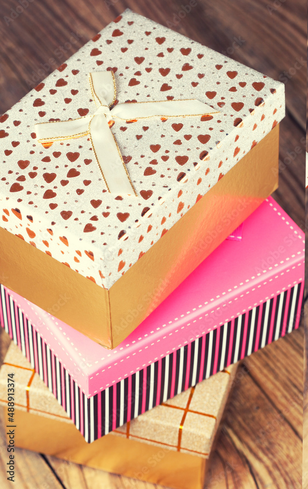 colorful gift boxes on wooden background colorful gift boxes on wooden background
