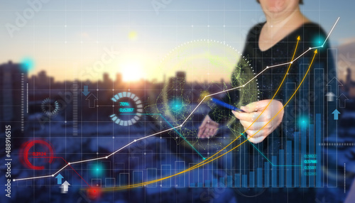 Businesswoman draw growth graph - business planning and strategy. Stock market and banking concept. Analyzing financial and investment data. Development of success in sales or digital marketing. 
