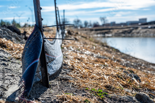  silt fence at a construction site with exposed dirt piled against the fabric