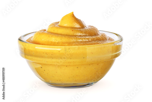 Bowl with mustard isolated on white. photo