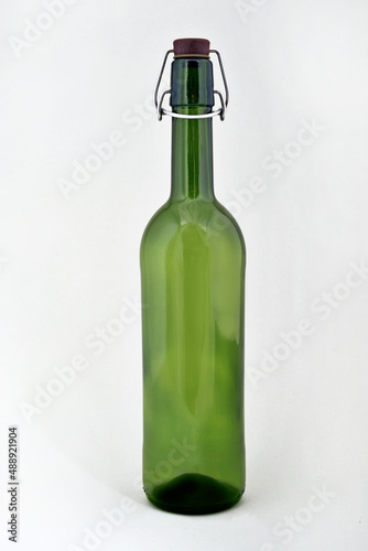 Сlosed green empty bottle for wine isolated on a white background.
