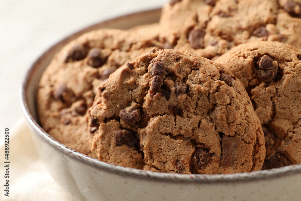 Delicious chocolate chip cookies in bowl, closeup