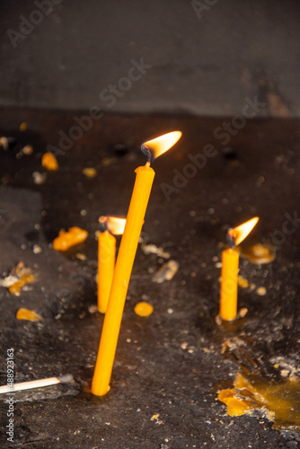 candles lit at a church in Romania 