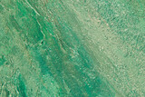 abstract background: textured plaster with emerald turquoise color, close
