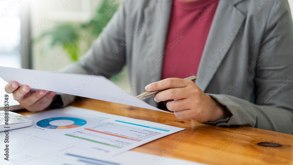 Business analyst concept the data analyst comparing the charts of the recent year and this year on the document Business analyst concept the data analyst comparing the charts of the recent year and this year on the document