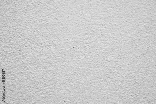 The rough surface of the wall or concrete floor is painted gray and white for the background.