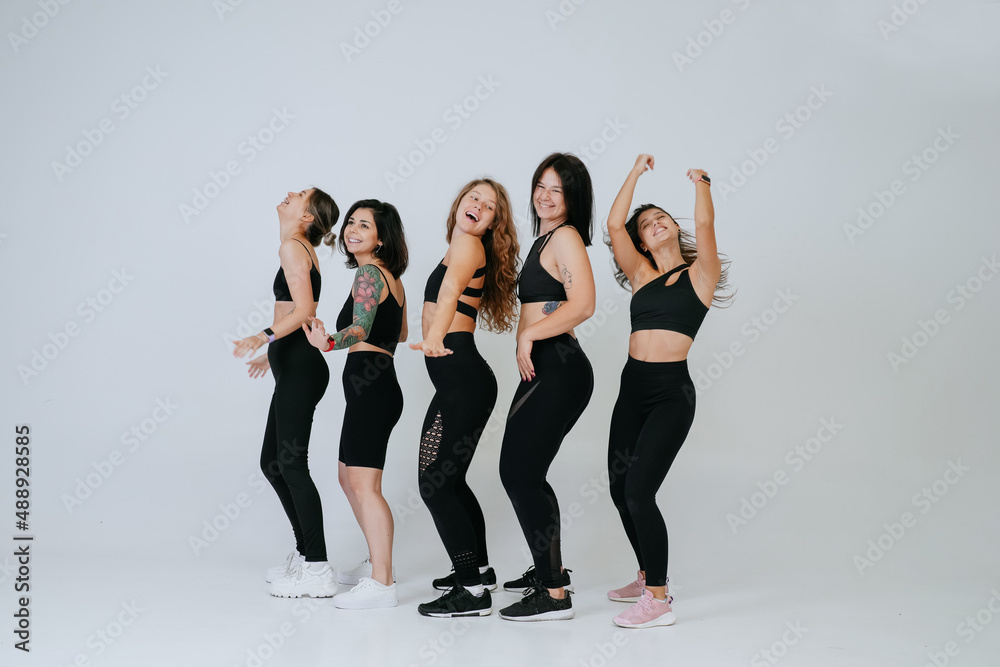 Fototapeta premium diverse models laughing, enjoying time together, look at camera