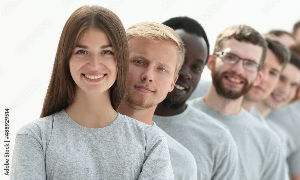 group of diverse young people standing in a row group of diverse young people standing in a row