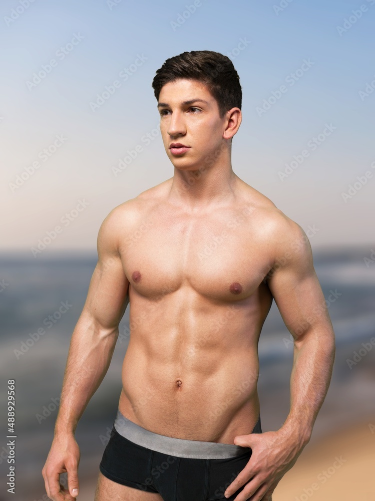 Sexy Portrait Of Muscular Handsome Topless Male Model At The Beach sexy-portrait-of-muscular-handsome-topless-male-model-at-the-beach