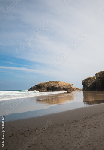 rocky beach with fine sand in summer