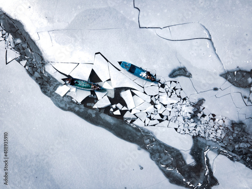 aerial shot of fishermen on ice
