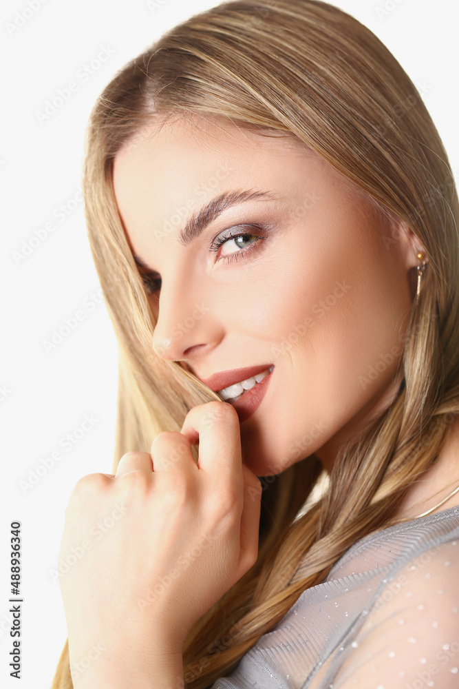 Flirting young stylish blonde woman posing on white background in studio Flirting young stylish blonde woman posing on white background in studio
