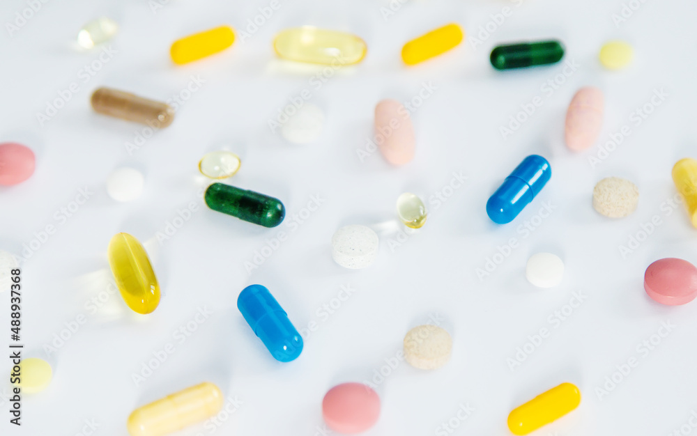 Supplements and vitamins on a white background. Selective focus. Supplements and vitamins on a white background. Selective focus.