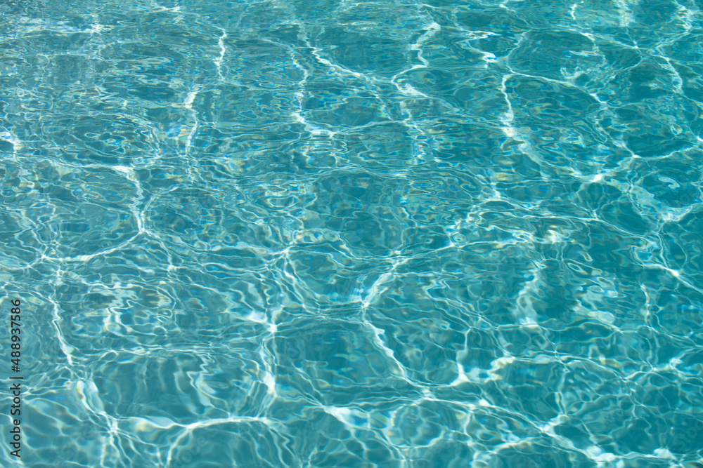 Water in swimming pool, background with high resolution. Wave abstract or rippled water texture.