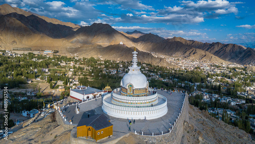 Aerial view Shanti Stupa buddhist white domed stupa overlooks the city of Leh, The stupa is one of the ancient and oldest stupas located in Leh city, Ladakh, Jammu Kashmir, India. photo