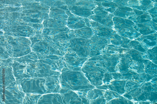 Water in swimming pool, background with high resolution. Wave abstract or rippled water texture. © Volodymyr