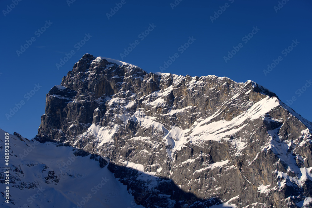 Famous Mount Titlis 3,238 meters above sea level at ski resort Engelberg in the Swiss Alps on a sunny winter day. Photo taken February 9th, 2022, Engelberg, Switzerland. - obrazy, fototapety, plakaty 