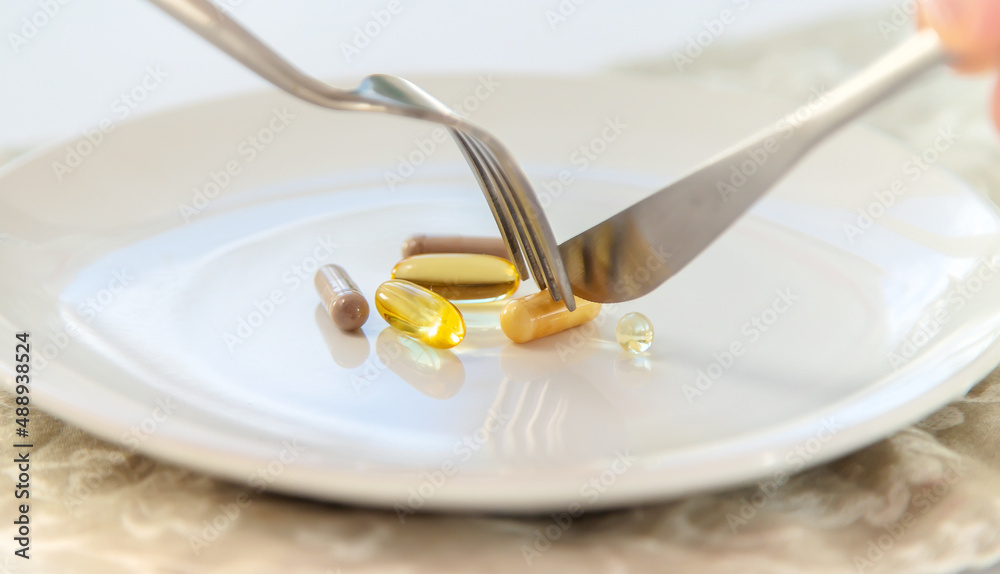 Supplements and vitamins on a plate. Selective focus. Supplements and vitamins on a plate. Selective focus.