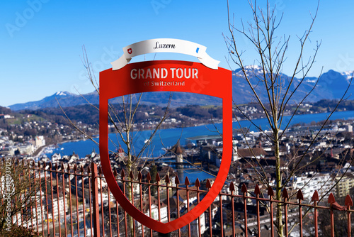 Canvas Print Aerial view through red metal frame of Grand Tour Switzerland from local mountain Gütsch over the City of Luzern on a sunny winter day
