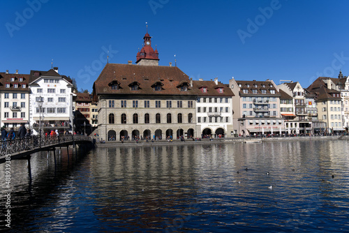 Cityscape of medieval old town of Luzern with river Reuss on a sunny winter day. Photo taken February 9th, 2022, Lucerne, Switzerland.