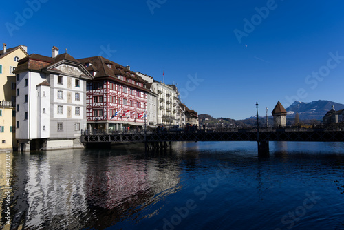 Cityscape of medieval old town of Luzern with river Reuss on a sunny winter day. Photo taken February 9th, 2022, Lucerne, Switzerland.
