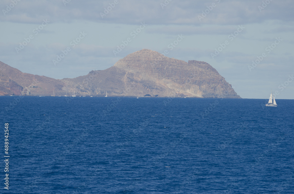Sailboat and yachts in front of the coast of Anaga. Santa Cruz de Tenerife. Tenerife. Canary Islands. Spain. Sailboat and yachts in front of the coast of Anaga. Santa Cruz de Tenerife. Tenerife. Canary Islands. Spain.