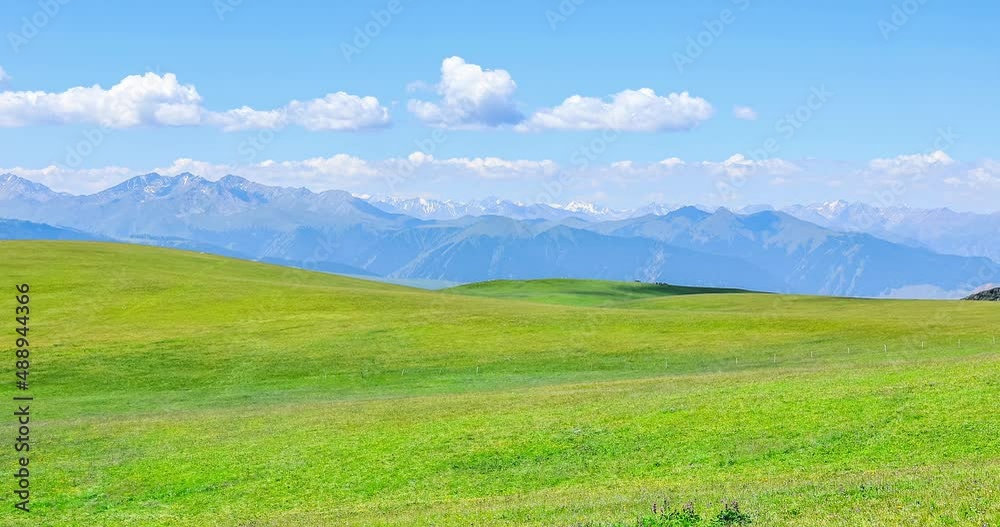 Green grassland and mountain natural scenery in Xinjiang, China. Green grassland and mountain natural scenery in Xinjiang, China.
