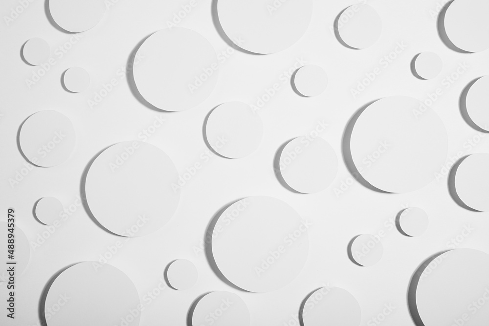 White simple geometric background with circles in hard light with grey shadows as energy stable pattern, top view. Futuristic minimal backdrop for advertising, design of poster, flyer, cover book.