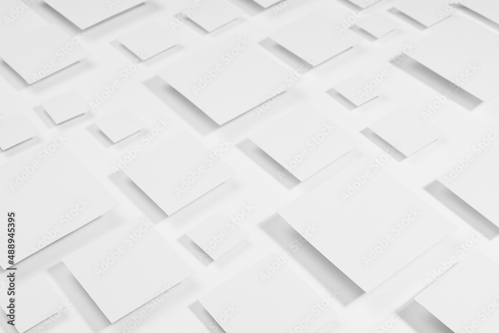 White geometric abstract background with rhombus in sunlight with strict light gradient grey shadows as pattern, top view. Simple contemporary backdrop in future style.