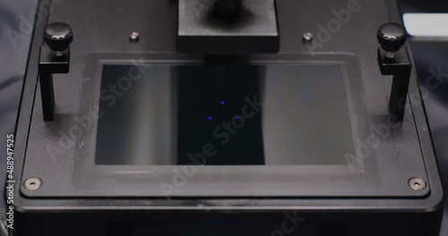 Timelapse of a MSLA 3d Printer or Masked Stereolithography or resin 3d printer, is a type of resin SLA 3D printer which use a LCD screen to mask UV light to cure resin into a shape. photo