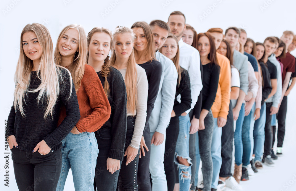 group of diverse young people standing in line.