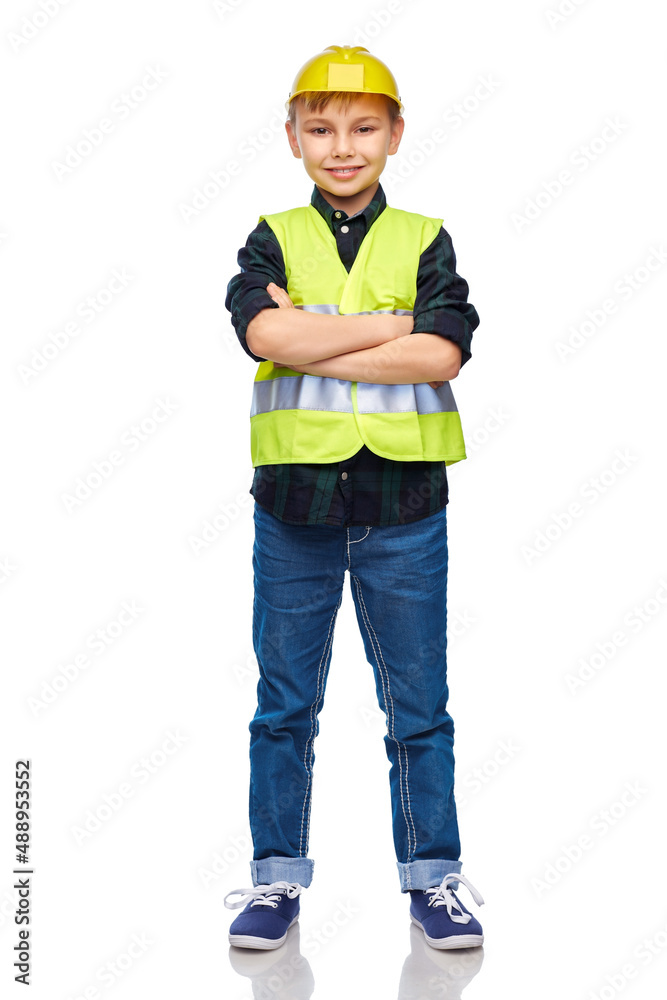 building, construction and profession concept - happy smiling little boy in protective helmet and safety vest with crossed arms over white background building, construction and profession concept - happy smiling little boy in protective helmet and safety vest with crossed arms over white background