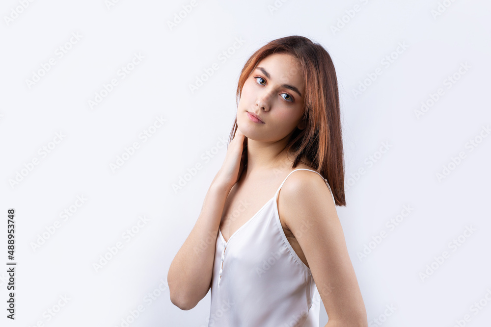 Beautiful smiling woman with clean skin, natural make-up and white teeth on a gray background Beautiful smiling woman with clean skin, natural make-up and white teeth on a gray background