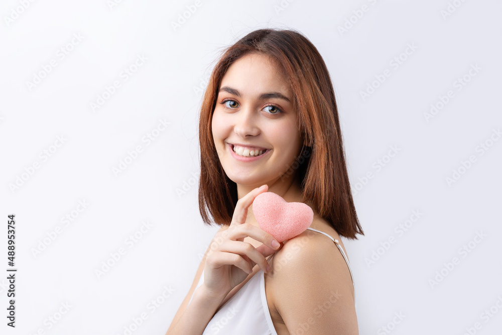 Beautiful smiling woman with clean skin, natural make-up and white teeth on a gray background Beautiful smiling woman with clean skin, natural make-up and white teeth on a gray background