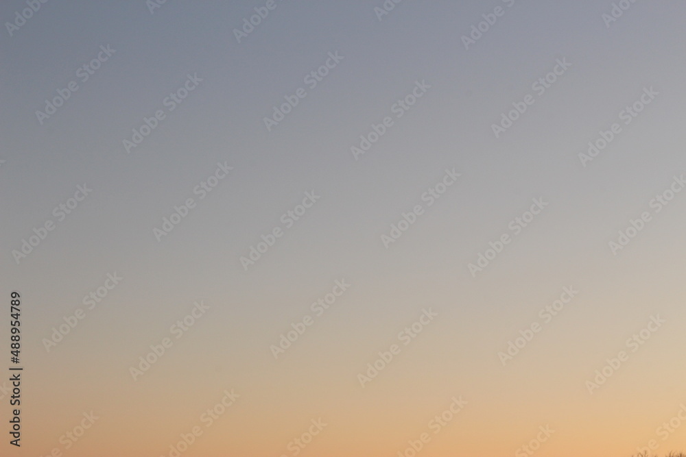 Sunrise or sunset wallpaper background with purple and orange hues