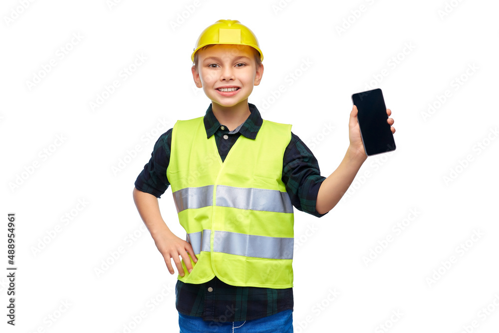 building, construction and profession concept - happy smiling little boy in protective helmet and safety vest with smartphone over white background building, construction and profession concept - happy smiling little boy in protective helmet and safety vest with smartphone over white background