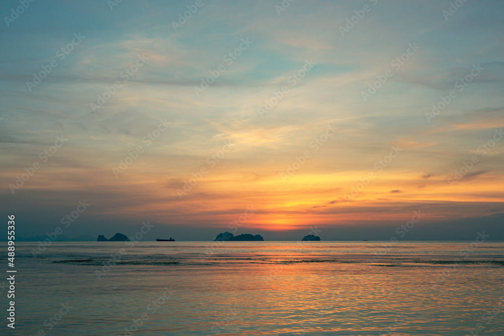 Spectacular colorful sunset over sea and islands on a summer evening. 
