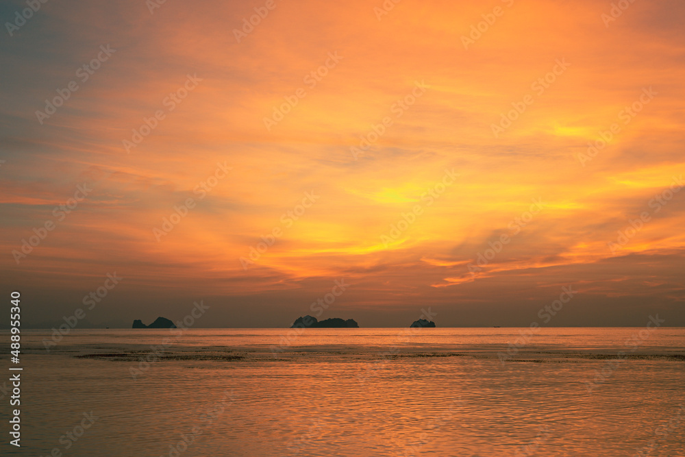 Spectacular colorful sunset over sea and islands on a summer evening. Spectacular colorful sunset over sea and islands on a summer evening.