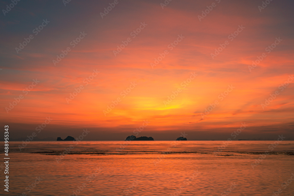 Spectacular colorful sunset over sea and islands on a summer evening. Spectacular colorful sunset over sea and islands on a summer evening.