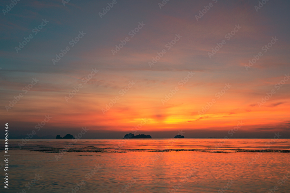 Spectacular colorful sunset over sea and islands on a summer evening. 