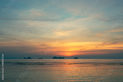 Spectacular colorful sunset over sea and islands on a summer evening.  © mizuno555