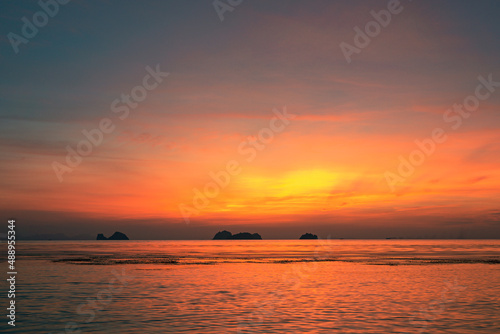 Spectacular colorful sunset over sea and islands on a summer evening. 