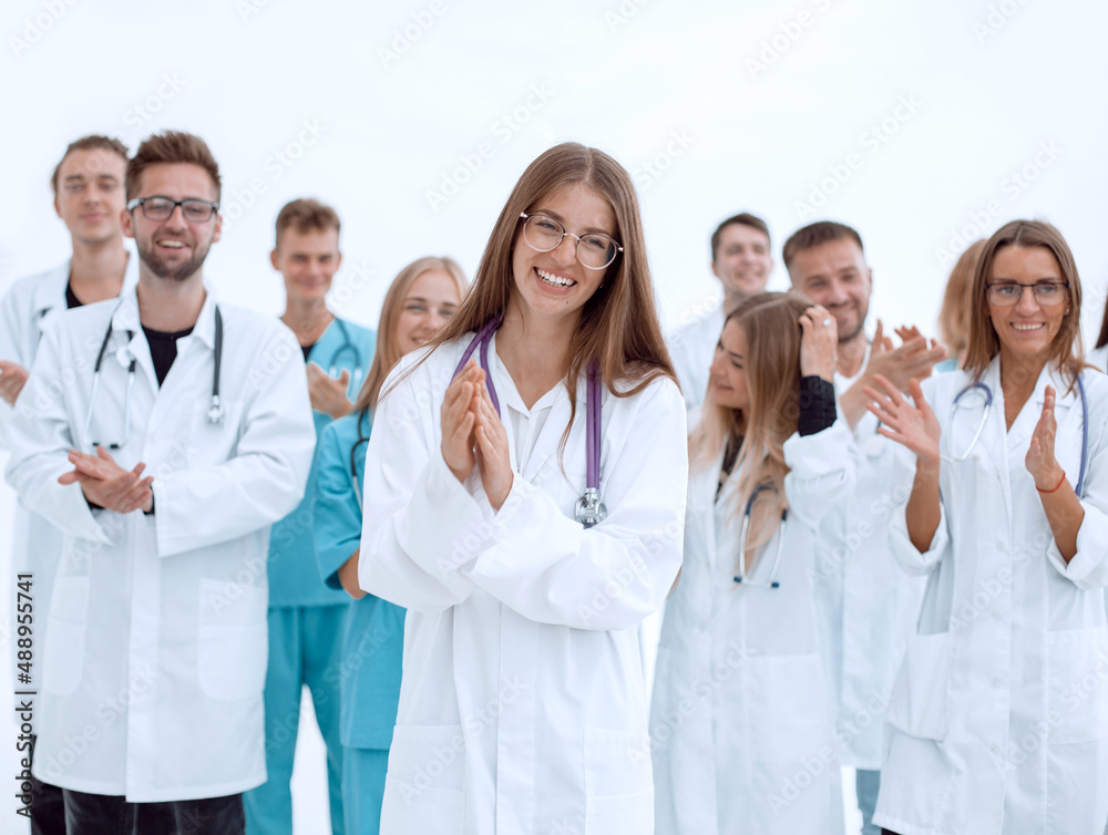 group of young doctors give a standing ovation group of young doctors give a standing ovation