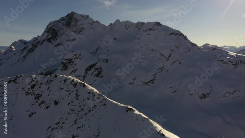 Summit of Chief Pascall with Joffre peak in the background in the winter photo